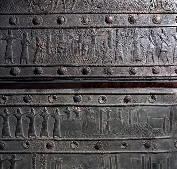 The wooden gates of Shalmaneser III with bands of relief decoration in bronze