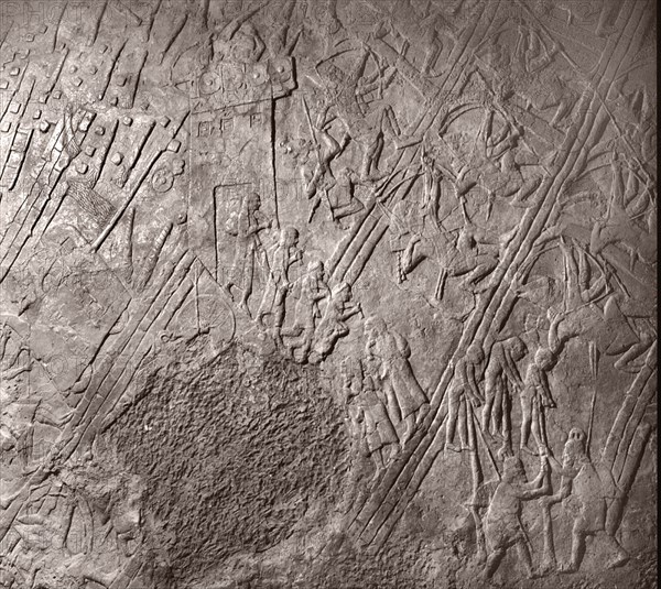 Stone relief from the palace of Sennacherib, depicting the assault on the gate tower of Lachish