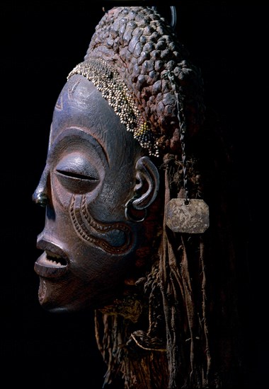 Dance mask of a type known as Mwana Pwo, regarded as an idealised depiction of a beautiful young girl, showing facial scarifications