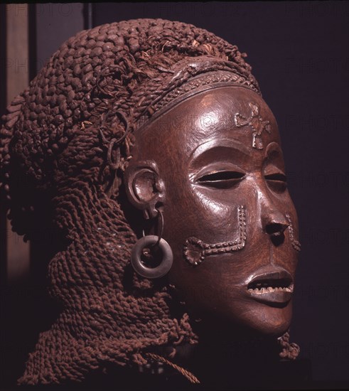 Dance mask of a type known as Mwana Pwo, regarded as an idealised depiction of a beautiful young girl, showing facial scarifications