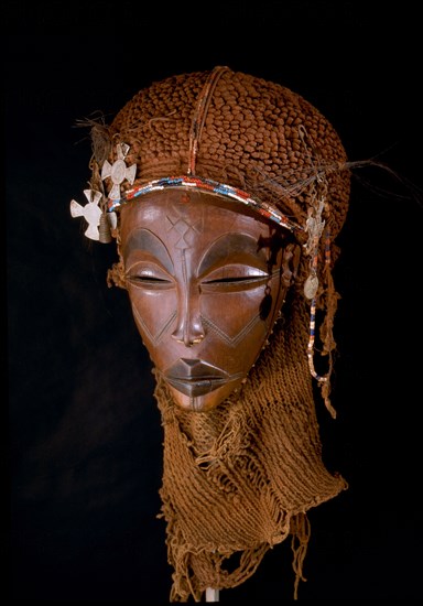 Dance mask of a type known as Mwana Pwo, regarded as an idealised depiction of a beautiful young girl, showing facial scarifications