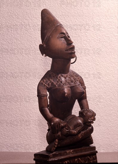 Mother and child carving (phemba) honouring female reproductive power, an idealised image of womens role, and by implication of the growth and wealth of the kingdom