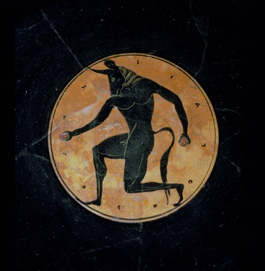 Attic, bilingual, eye cup with black figure interior depicting running minotaur and inscription reading the boy is beautiful