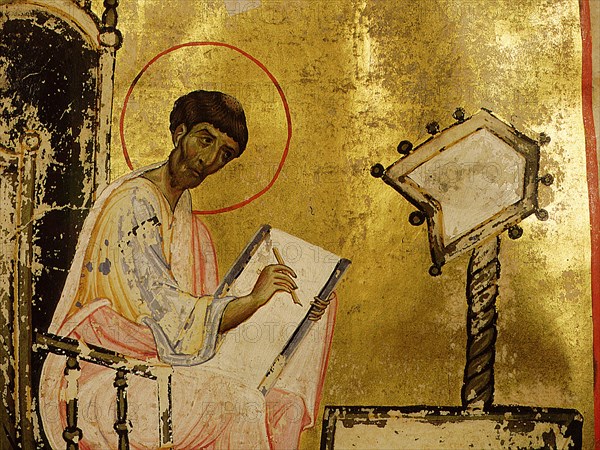 A detail of an illumination depicting St Luke writing at his desk