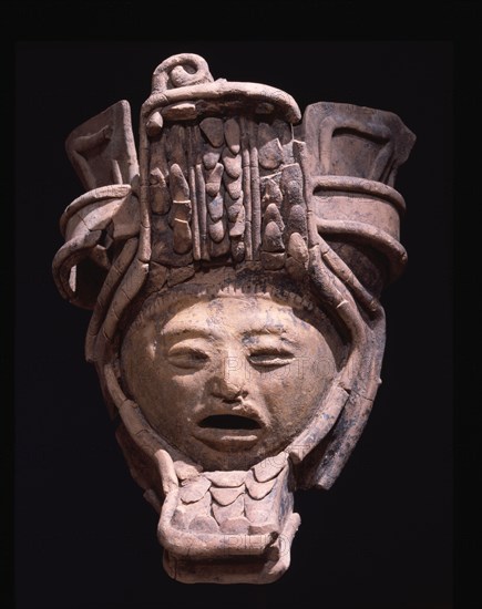 Pottery figurine with elaborate headdress