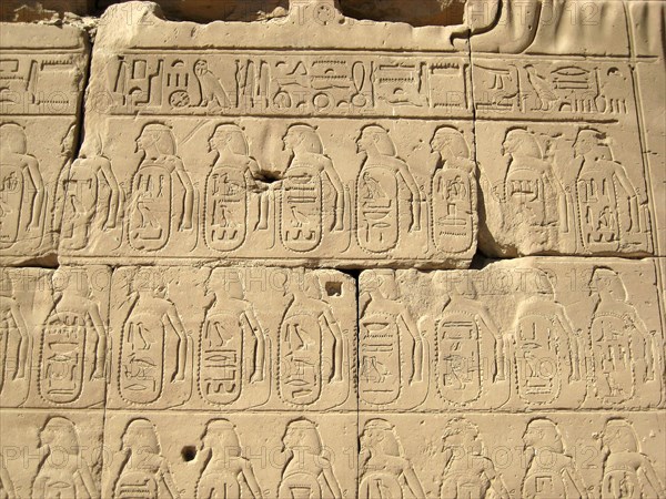Relief of hieroglyphic insription and captive in the Cachette Court
