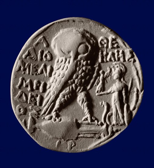 Athenian four drachma (tetradrachm) coin with the symbols of the city, the owl and the statue of Athena Parthenos