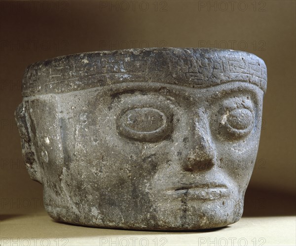 Stone head with turban like headdress