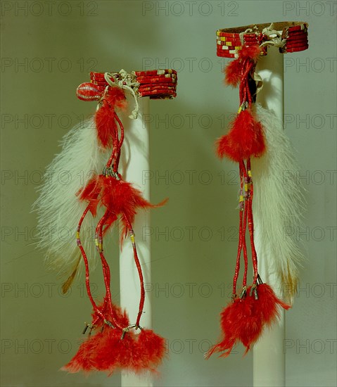 Armbands like these, decorated with porcupine quillwork and feathers, would have been worn on the upper arm by a Sioux dancer as part of a set of dance costume accessories