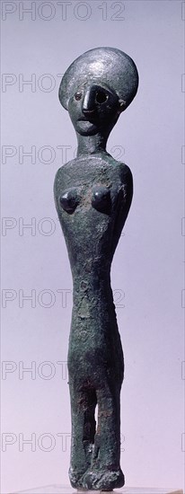 Bronze female statuette, found in association with a figurine of a horned god