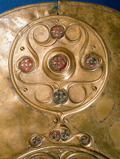 Bronze shield decorated with studs in red glass paste