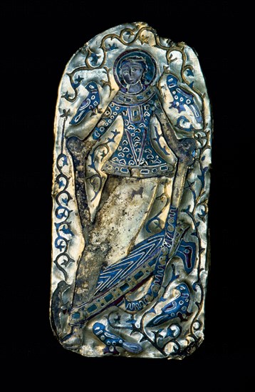 A gold and enamel plaque with a figure of a dancing girl