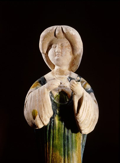 Pottery figure of a court lady holding a bird