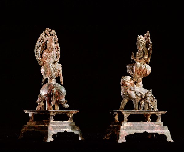 A pair of Bodhisattva Guanyin, one on a lion, the other on an elephant