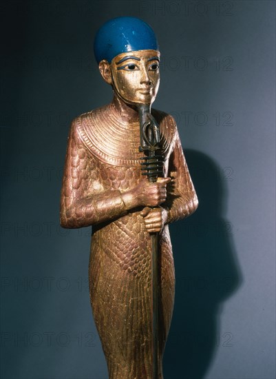 Gold statue of Ptah god of Memphis   patron of artists and craftsmen from the Tutankhamun burial