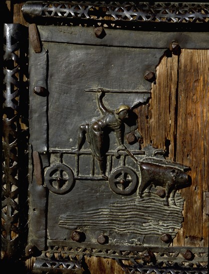 Detail of the bronze door of the Basilica of San Zeno which is decorated with 48 panels illustrating biblical stories and the lives of St Peter, St Paul, St Zeno, St Helena among others, and items connected with music and the three Theological Virtues