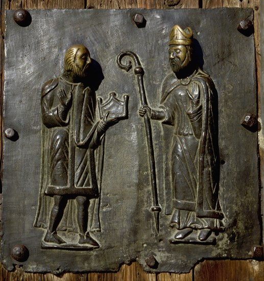 Detail of the bronze door of the Basilica of San Zeno which is decorated with 48 panels illustrating biblical stories and the lives of St Peter, St Paul, St Zeno, St Helena among others, and items connected with music and the three Theological Virtues