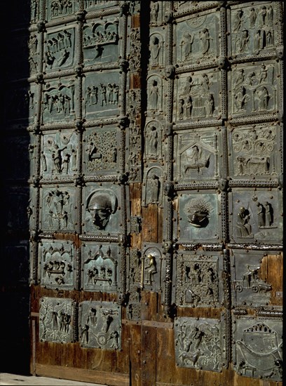 Detail of the bronze door of the Basilica of San Zeno which is decorated with 48 panels illustrating biblical stories and the lives of St Peter, St Paul, St Zeno, St Helena among others, and items connected with music and the three Theological Virtues