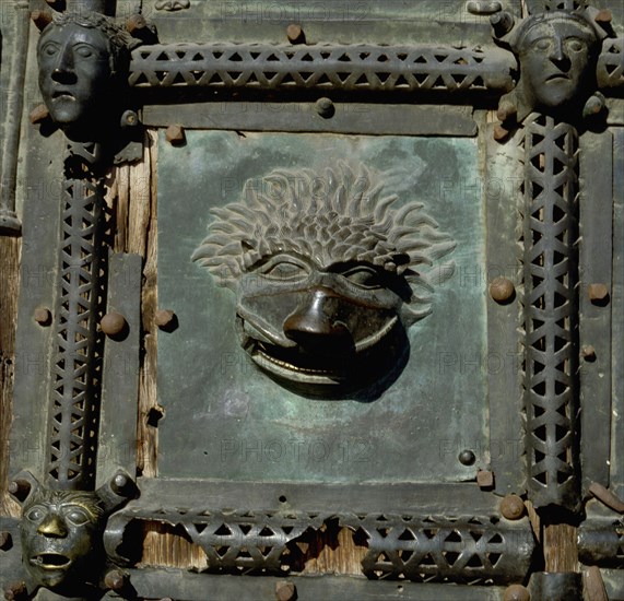 Detail of the bronze door of the Basilica of San Zeno which is decorated with 48 panels illustrating biblical stories and the lives of St Peter, St Paul, St Zeno, St Helena among others, and items connected with music and the three Theological Virtues