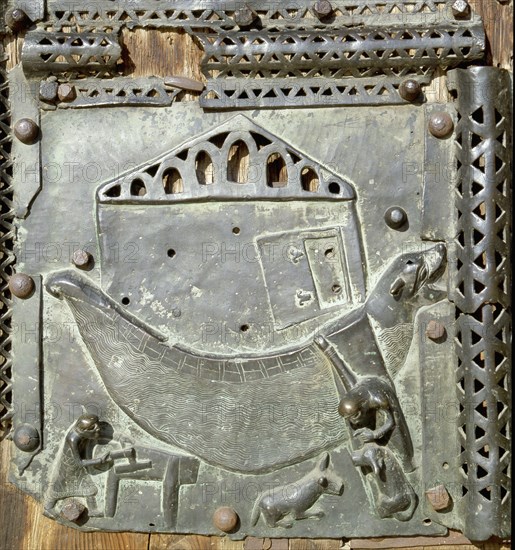 Detail of the bronze door of the Basilica of San Zeno which is decorated with 48 panels illustrating biblical stories and the lives of St Peter, St Paul, St Zeno, St Helena among others, and items connected with music and the three Theological Virtues