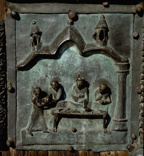 Detail of the bronze door of the Basilica of San Zeno which is decorated with 48 panels illustrating biblical stories and the lives of St Peter, St Paul, St Zeno, St Helena among others, and items connected with music and the three Theological Virtues
