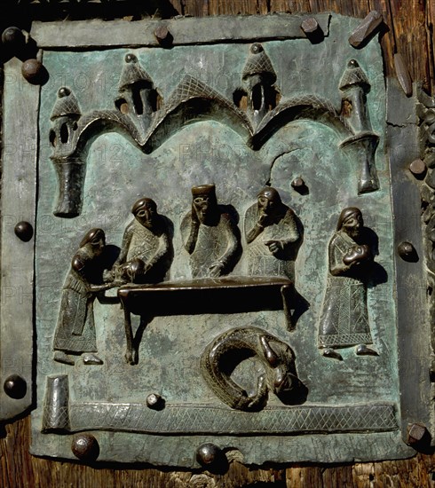 Detail of the bronze door of the Basilica of San Zeno which is decorated with 48 panels illustrating biblical stories and the lives of St Peter, St Paul, St Zeno, St Helena among others, and items connected with music and the three Theological Virtues