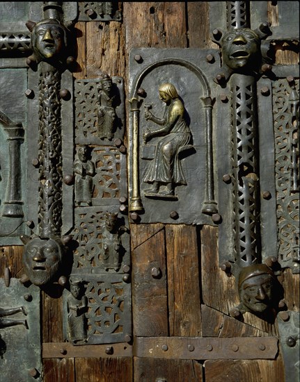 Detail of the bronze door of the Basilica of San Zeno which is decorated with 48 panels illustrating biblical stories and the lives of St Peter, St Paul, St Zeno, St Helena among others, and items connected with music and the three Theological Virtues