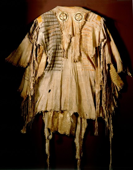 A deerskin war shirt which belonged orignially to a Blood (a Blackfoot sub tribe) chief named Katookinay (No Top Knot)