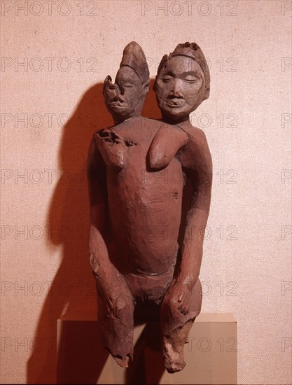 Two headed female figure