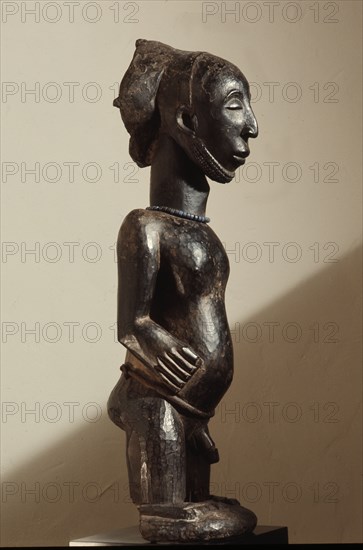 Fully rounded figure of a male revered ancestor and village founder, used as a focus for rituals to ensure agricultural fertility and the continuity of the lineage