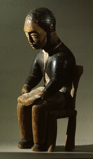 This figure of a man reading a book is believed to depict a Swedish or Swiss missionary