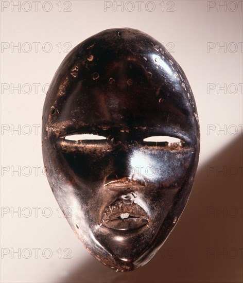 Mask of a type called Deangle, which collects food from village women and brings it to boys secluded in the bush circumcision camp