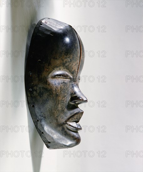 Mask of a type called Deangle, which collects food from village women and brings it to boys secluded in the bush circumcision camp