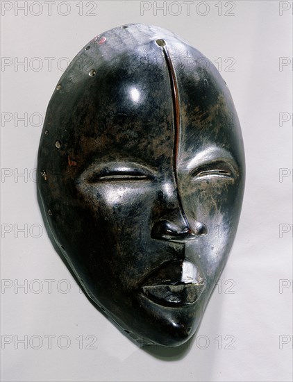 Mask of a type called Deangle, which collects food from village women and brings it to boys secluded in the bush circumcision camp