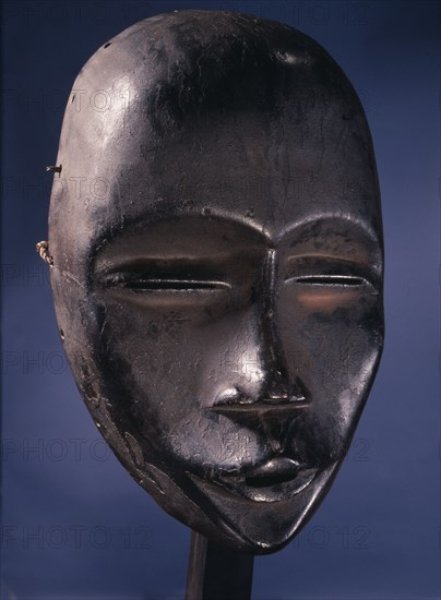 Mask of a type called Deangle, which collects food from village women and brings it to boys secluded in the bush circumcision camp