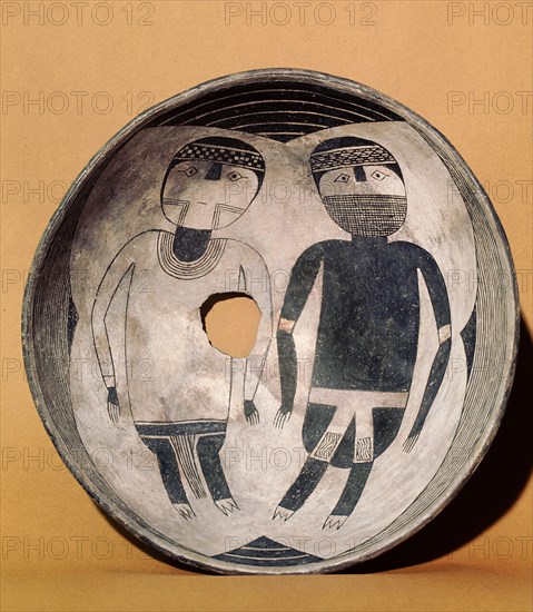 Pottery bowl painted with two figures, possibly representing the contrast between male and female or life and death