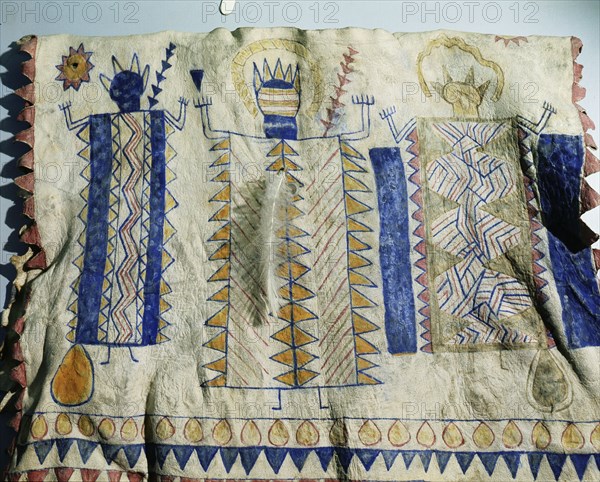 Warriors cloak painted with representations of a god and spirits