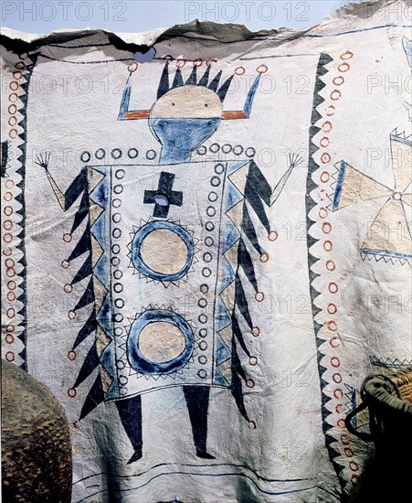 Detail of a warriors cloak painted with a figure of an Apache Kan (god)