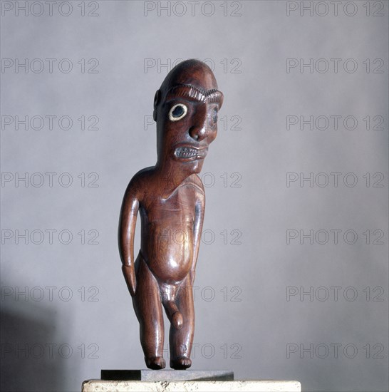 An ancestral figure known as a moai kavakava, emaciated man, worn hung onto its owner at dances and feasts