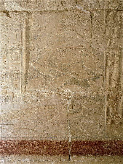 A scene in relief in the tomb of the vizier Mereruka showing fishing in a papyrus thicket