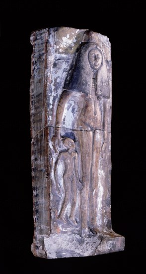 Magical amulet in the form of a mother and baby lying on a bed