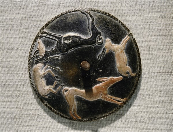 A gaming disc, one of 45 made of various materials and variously decorated, found in the mastaba of Hemaka, an official of King Den
