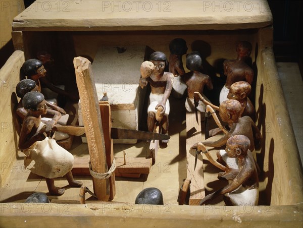 Wooden model of a carpentry workshop with craftsmen at work