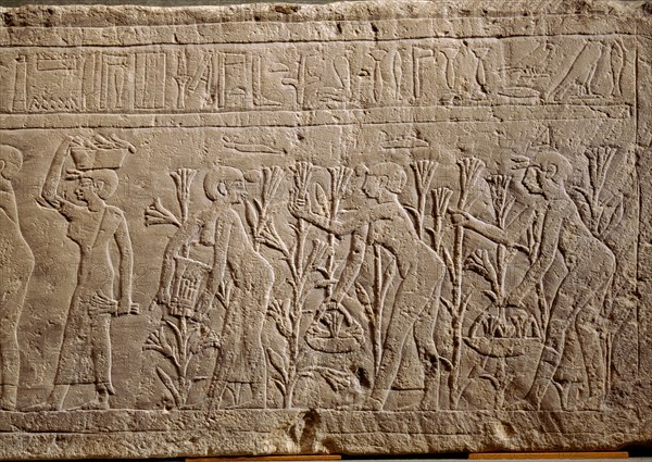 Relief showing servant women picking lilies for use in perfume