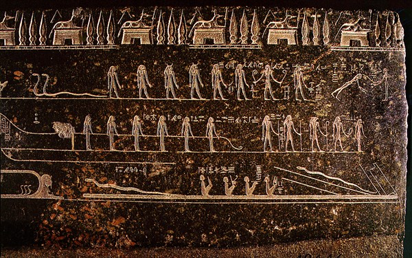 Detail from a sarcophagus depicting the goddesses pulling the divine bark while the gods clear the way