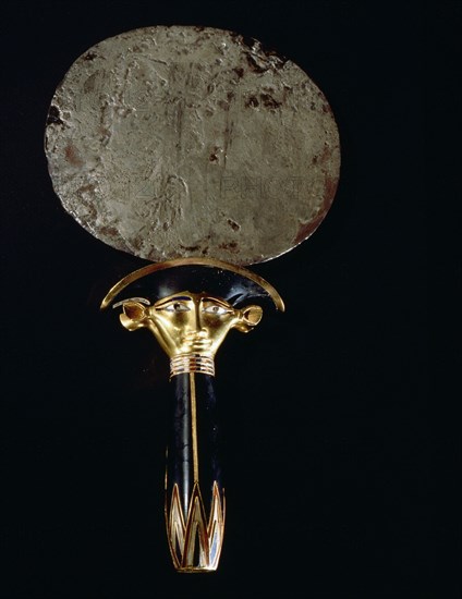 Silver mirror of princess Sathathoryunet, with handle in the form of a papyrus stem and the double sided face of the cow goddess Hathor