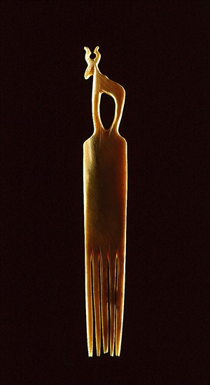 Bone comb crowned with a stylised representation of a gazelle or a similar horned animal