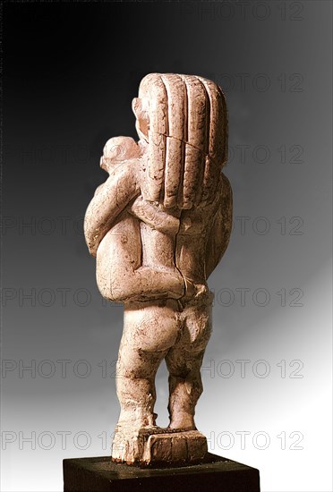 Mother carrying baby on her left hip