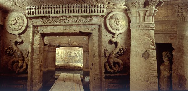 The extensive complex of burial chambers at Kom el Shuqafa, combining Greek and Egyptian design elements