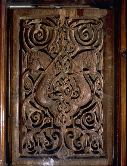 Detail of a door with horses and foliage decoration